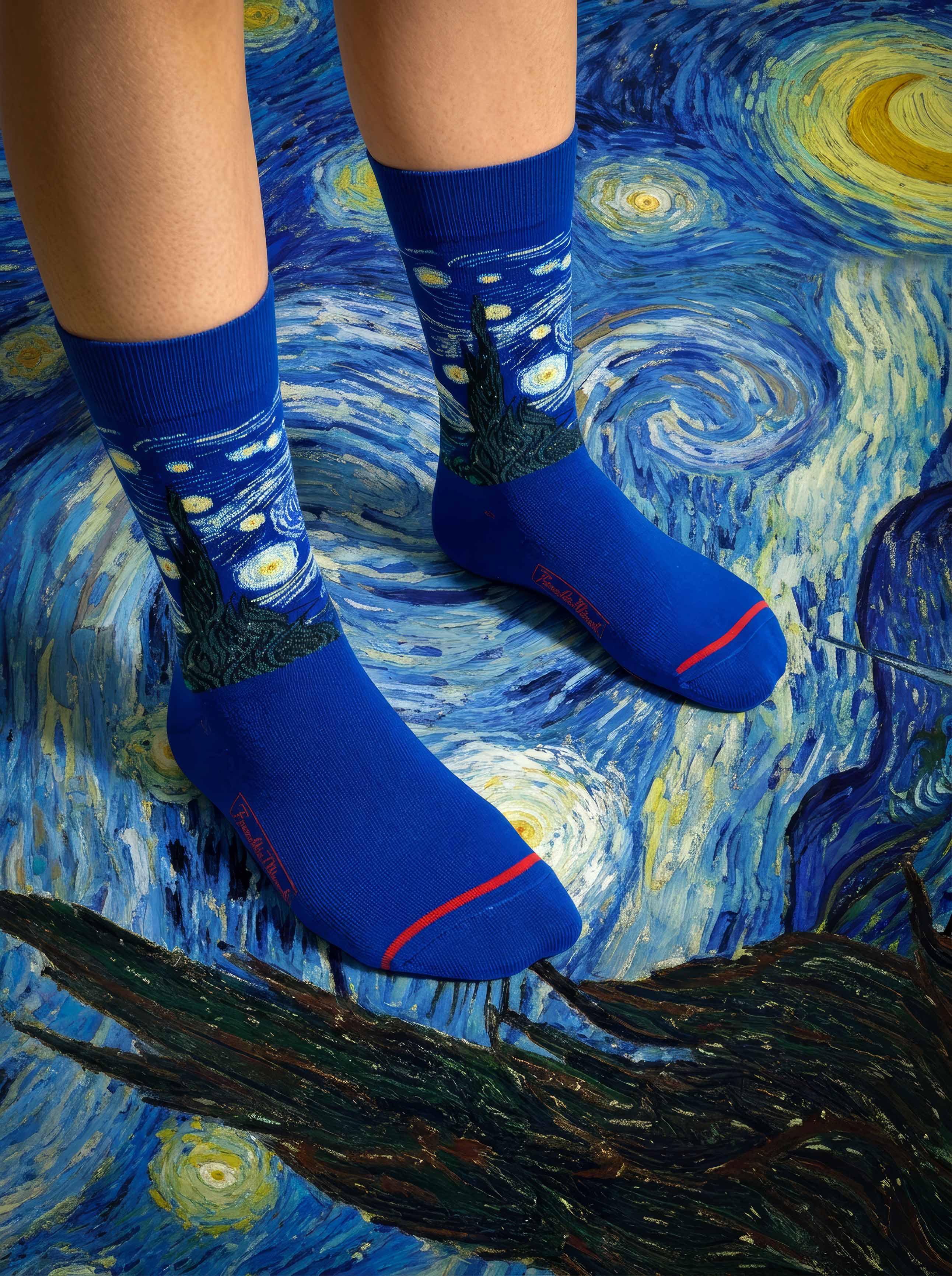 MuseARTa Van Gogh Starry Night art socks worn against Starry Night painting close-up — MoMA museum gift ArtyGifts
