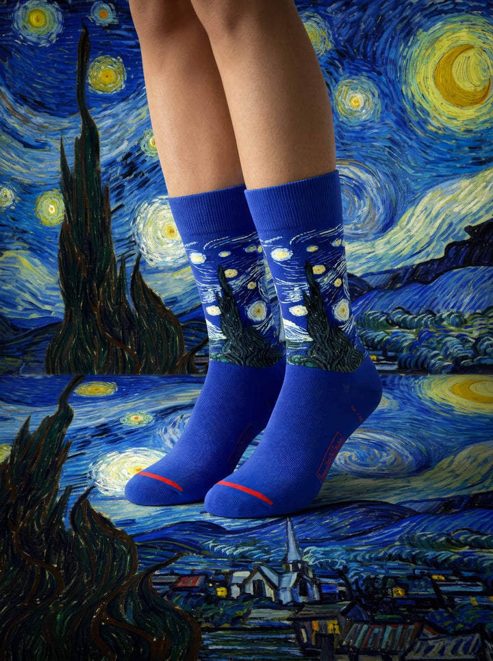 Two people wearing MuseARTa Van Gogh Starry Night art socks against Starry Night painting — unisex MoMA art gift ArtyGifts
