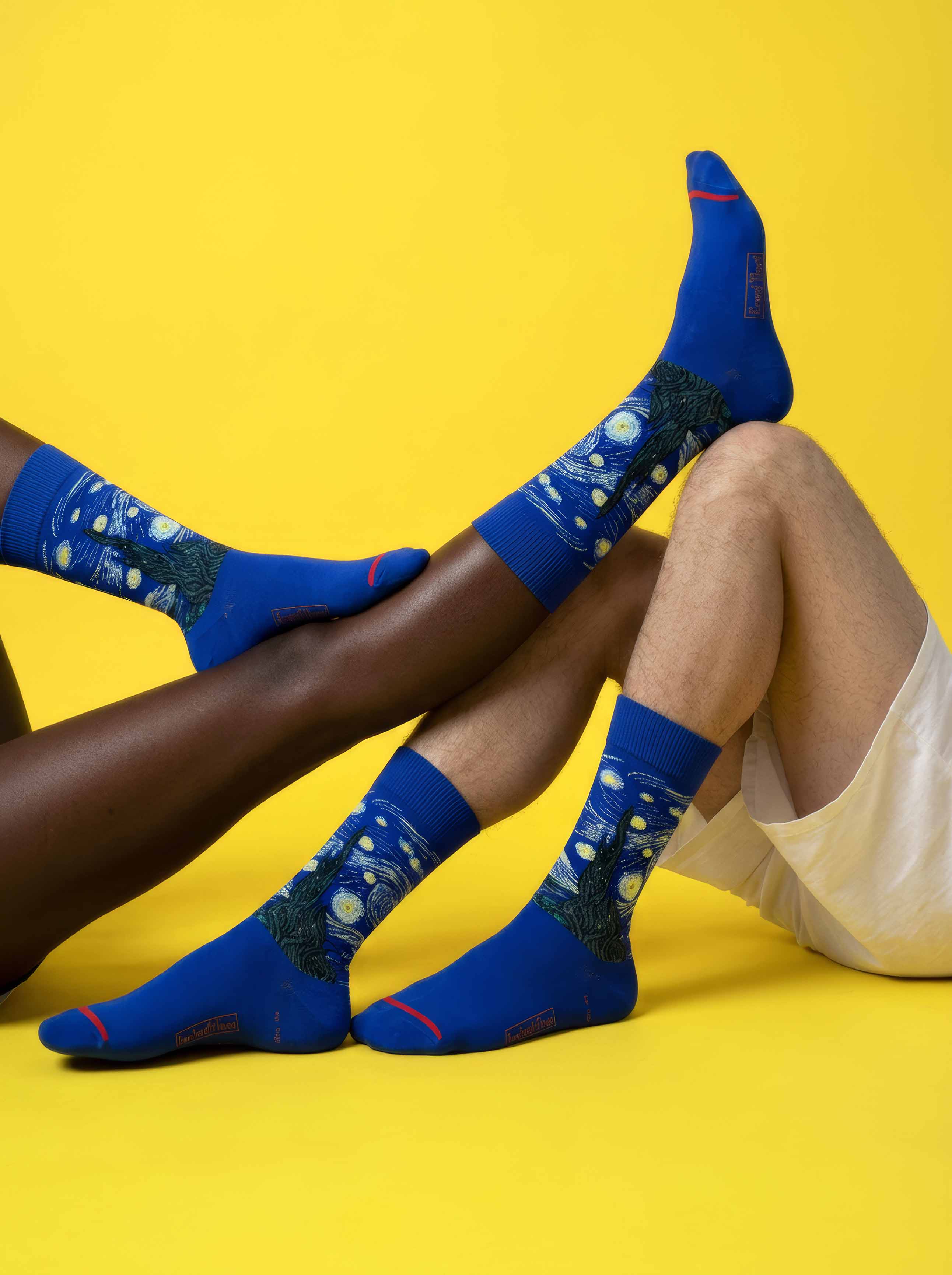 MuseARTa Van Gogh Starry Night art socks on yellow background worn by diverse couple — unisex Post-Impressionism gift ArtyGifts
