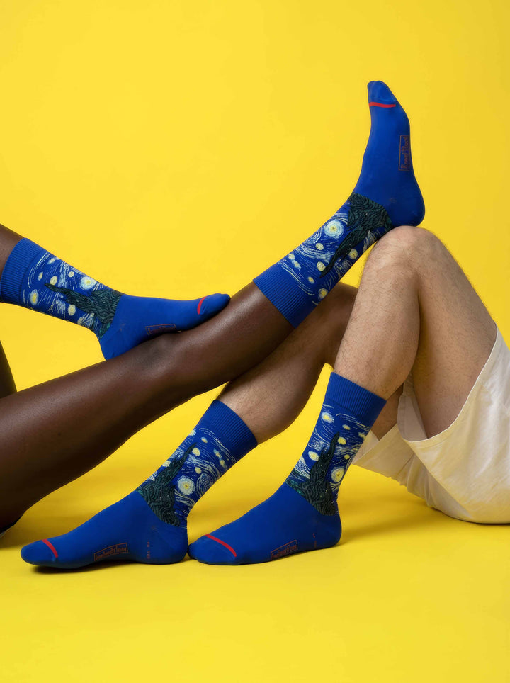 MuseARTa Van Gogh Starry Night art socks on yellow background worn by diverse couple — unisex Post-Impressionism gift ArtyGifts
