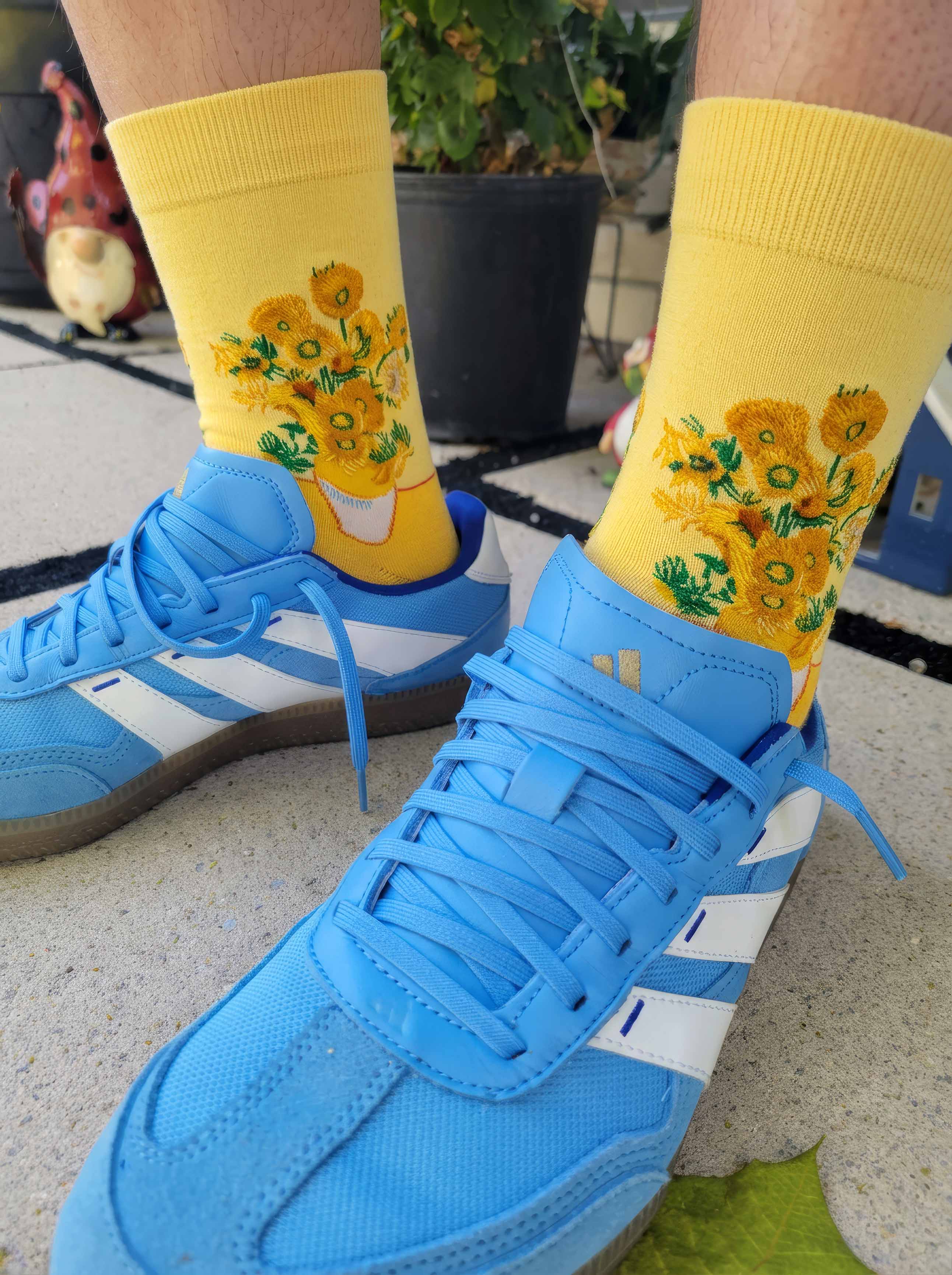 Van Gogh Sunflowers art socks worn with blue Adidas sneakers outdoors — unisex art gift ArtyGifts