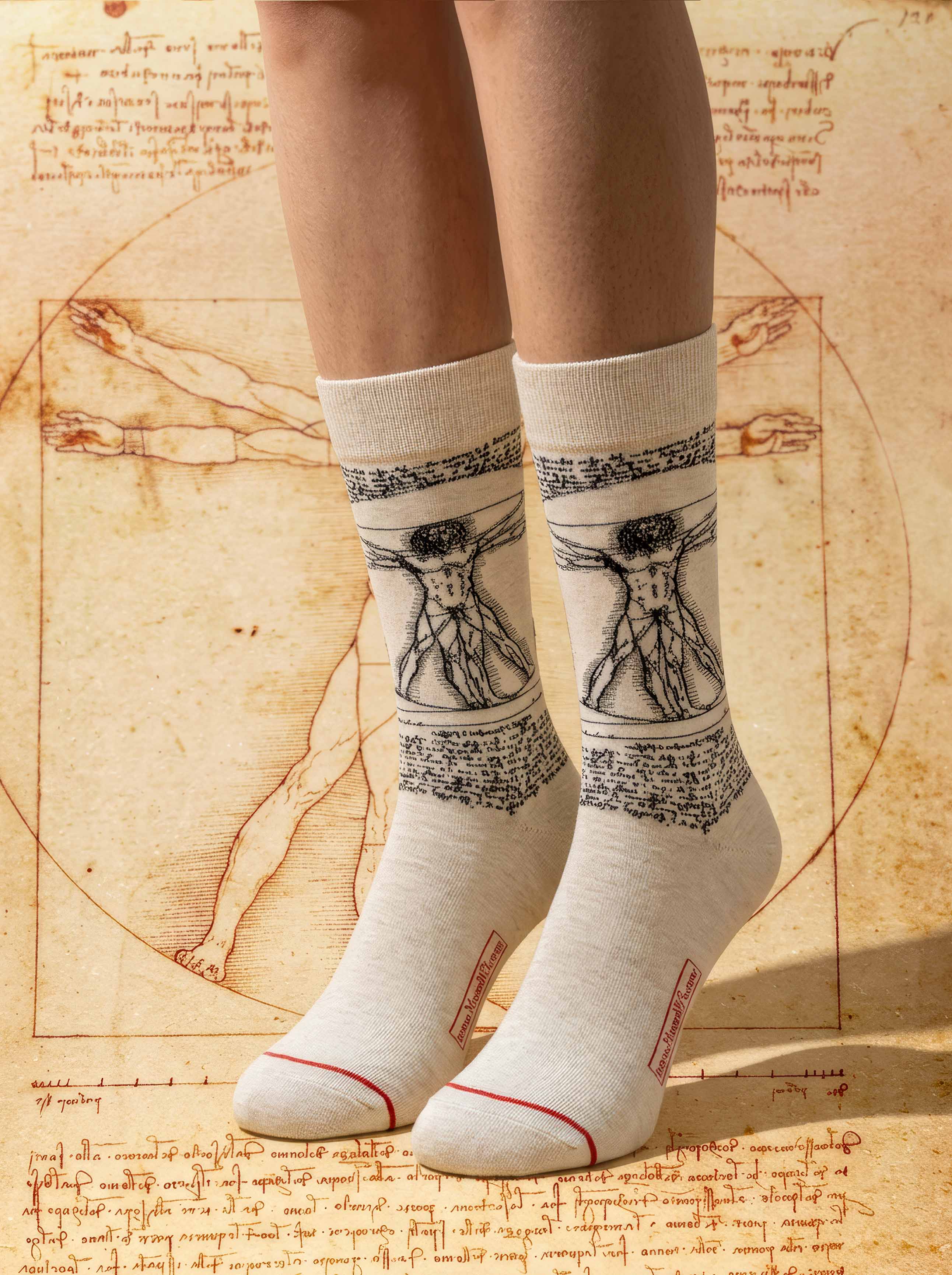 Da Vinci Vitruvian Man art socks on Da Vinci anatomical sketch background — ArtyGifts