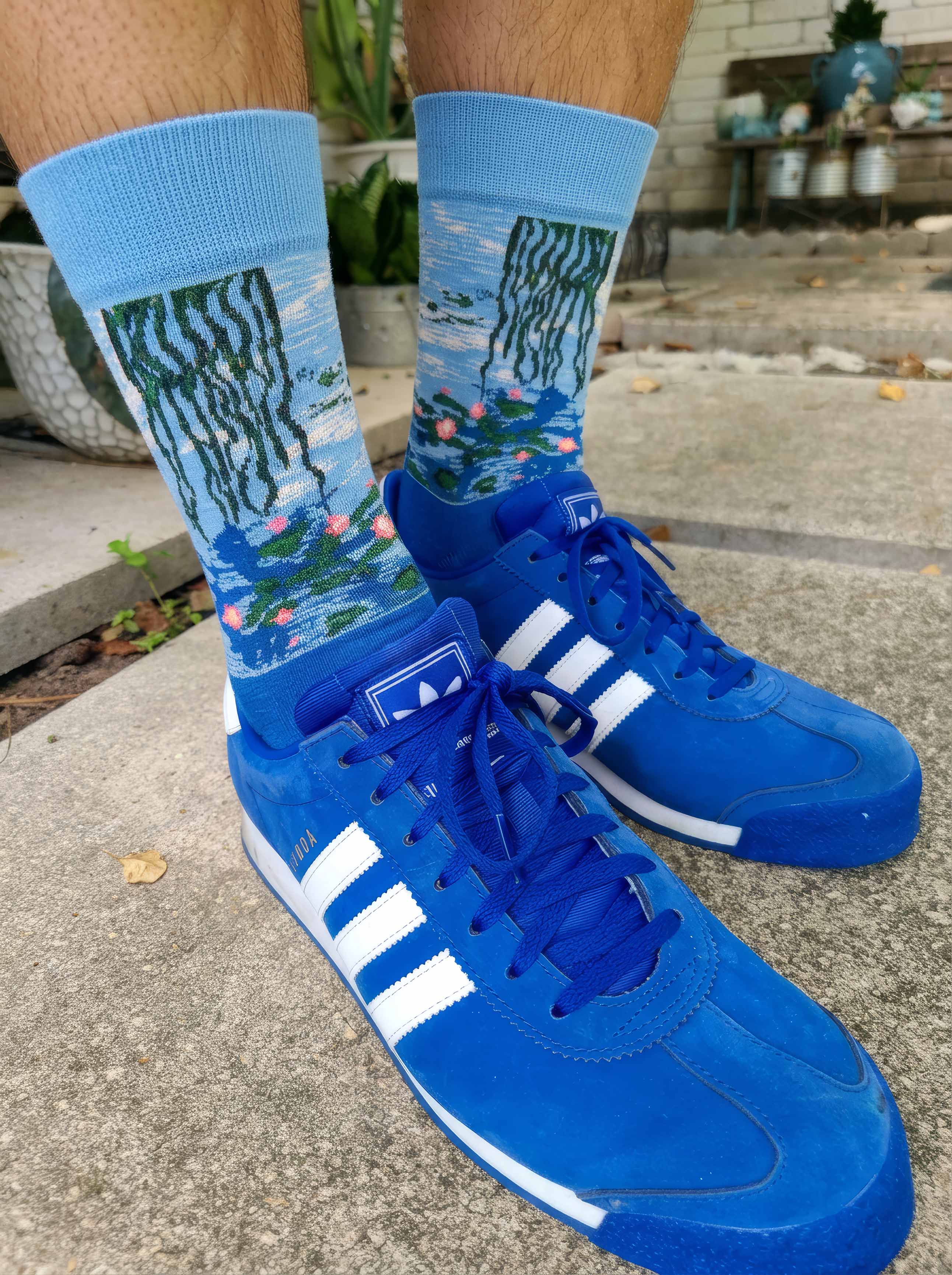 Man wearing MuseARTa Monet Water Lilies art socks with blue Adidas sneakers — lifestyle art gift ArtyGifts