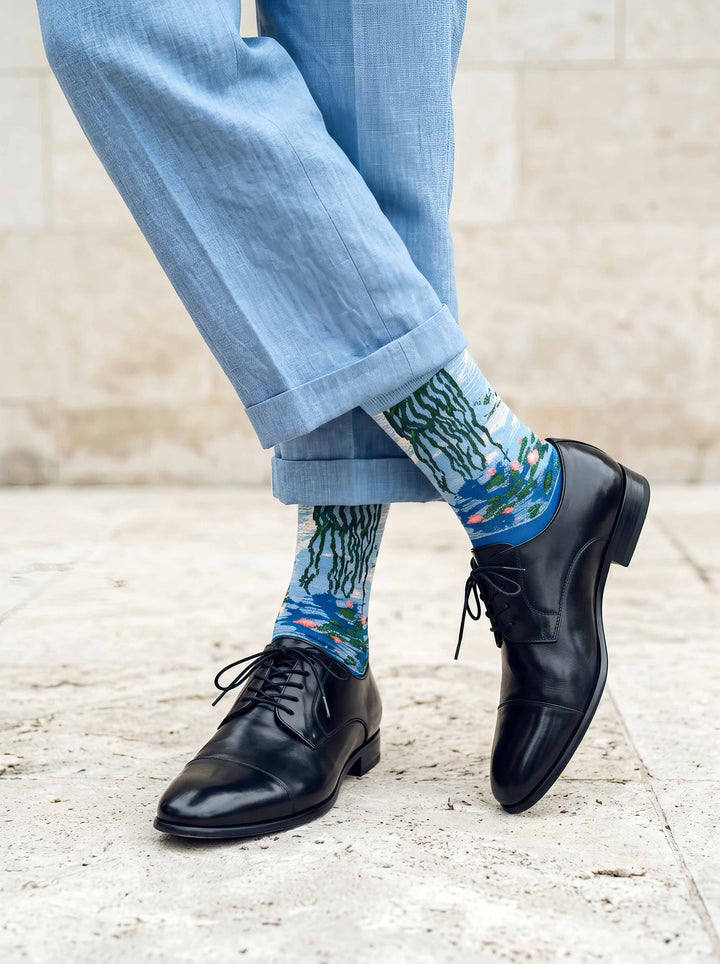 Man wearing MuseARTa Monet Water Lilies art socks with black Oxford shoes — classic art gift ArtyGifts